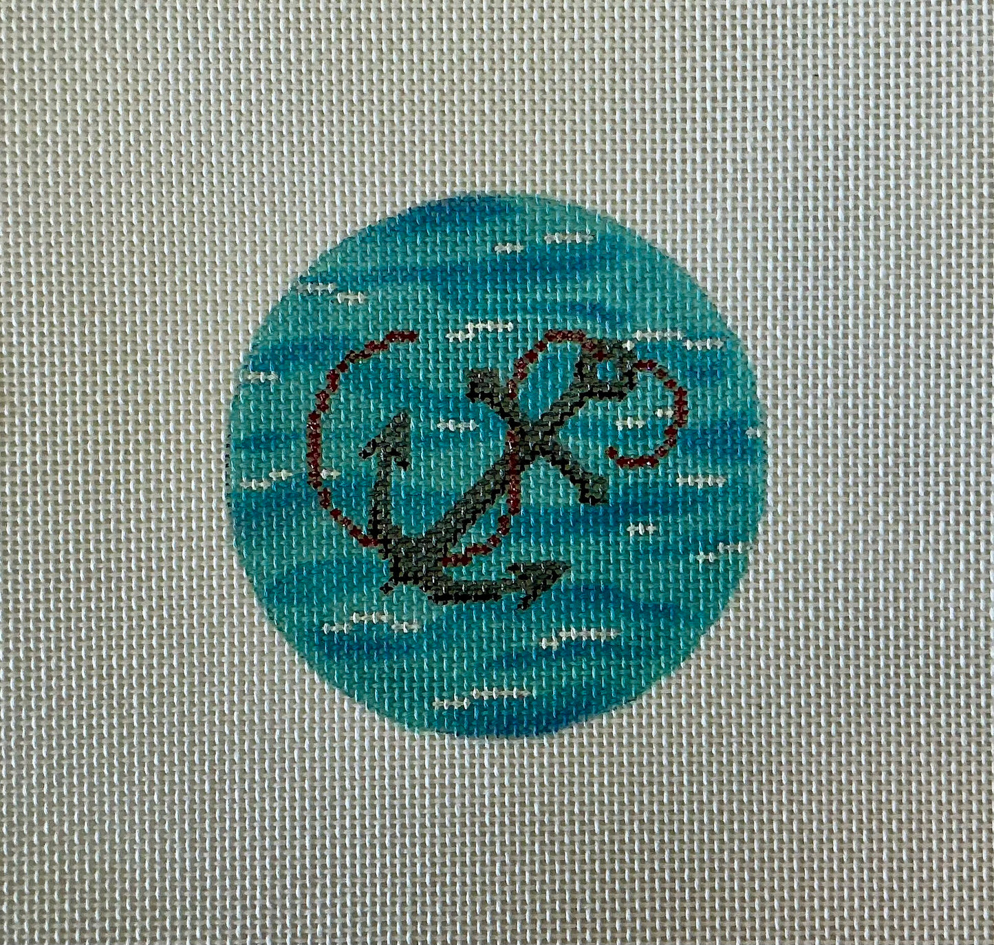 Grey Anchor with Rope on Ocean Round