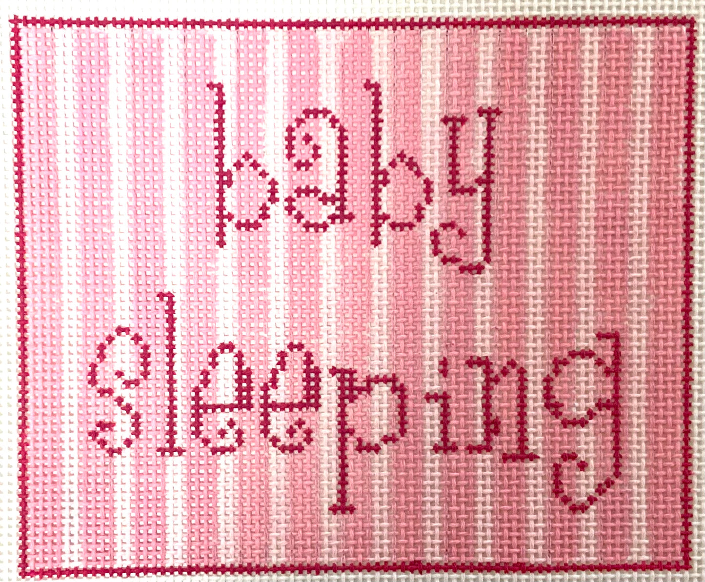 Baby Sleeping with Pink Stripes